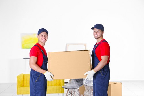 Man with van loading furniture for a local move in Enfield