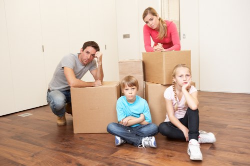 Local removals team handling furniture during an urgent move in Enfield