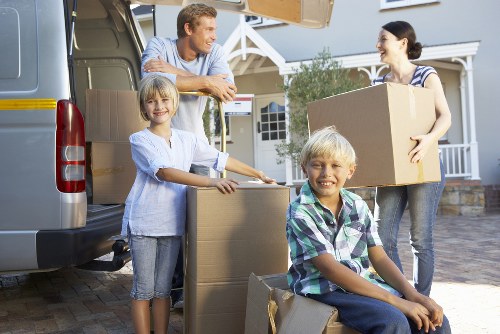A removals van loading student belongings near residential streets in Enfield